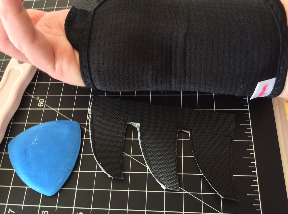 Wrist brace being worn, with the blue chalk mark faintly visible.