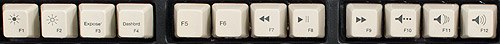 Media keys (most of the function keys) on the SpaceSaver M. F1 and F2 are brightness; F3 is Exposé (seemingly labeled “Expose´” with the accent mark after the e); F4 is Dashboard; F7 through 9 are playback controls; F10 through 12 are volume controls.