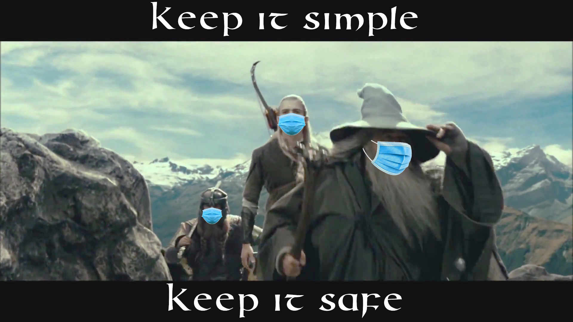 A screenshot from one of the “The Lord of The Rings” movies, showing Gandalf, Legolas, and Gimli hiking up a hill (with the others behind, out of frame), edited to have masks on all three visible faces, with the caption “Keep it simple” above and “Keep it safe” below.