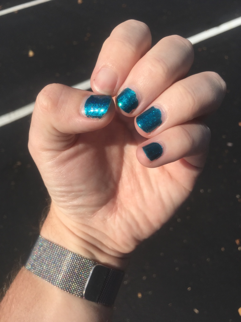 Sassy+Chic #903 (unnamed), a slightly glittery dark teal color, with Sinful Colors “Teal Midnight” glitter polish over it.